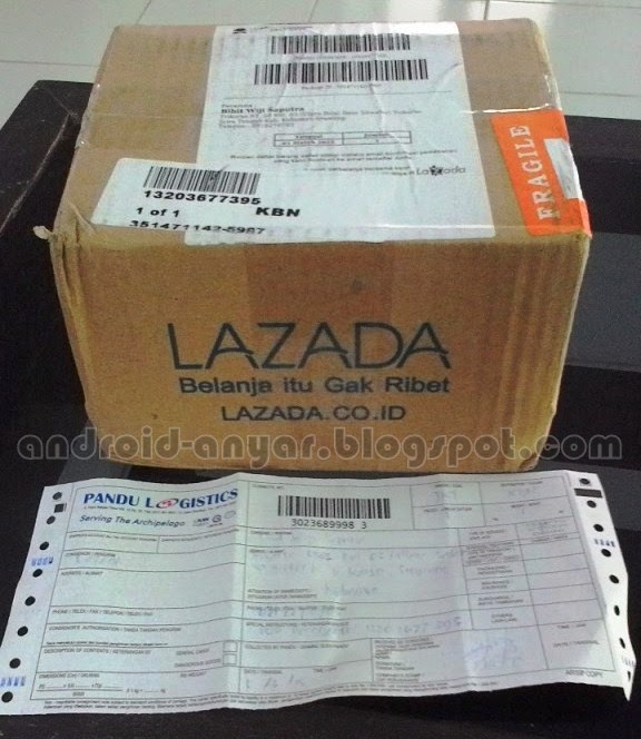 Kardus paket dari Lazada sebelum dibuka beserta resi Pandu Logistics